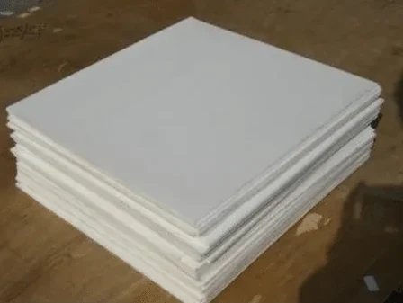 Stacked white PTFE laminate sheets